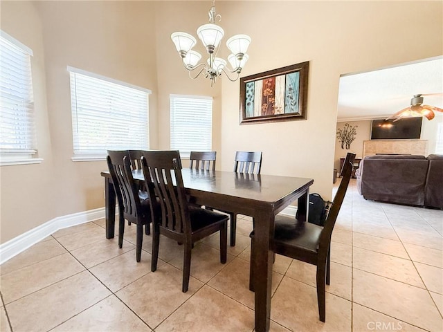 26490 Mapleridge Way, Moreno Valley, CA 92555 - dining space with a chandelier, light tile patterned floors, a towering ceiling, and baseboards