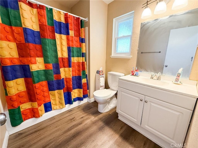 26490 Mapleridge Way, Moreno Valley, CA 92555 - full bath featuring wood finished floors, toilet, and vanity