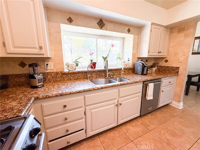 26490 Mapleridge Way, Moreno Valley, CA 92555 - kitchen featuring stainless steel dishwasher, a sink, range, light tile patterned flooring, and white cabinets