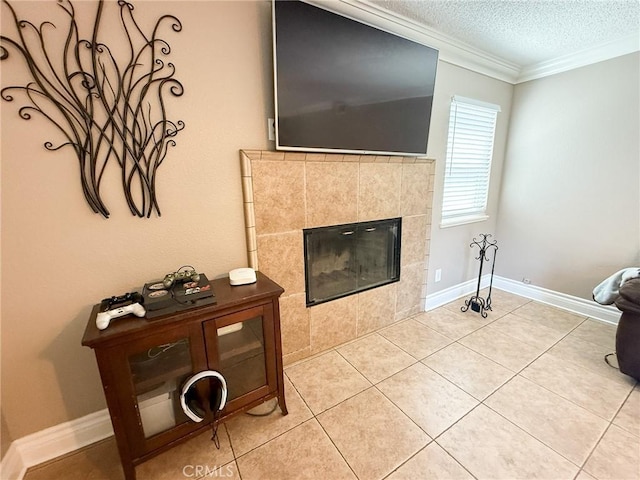 26490 Mapleridge Way, Moreno Valley, CA 92555 - living room featuring a textured ceiling, crown molding, a tile fireplace, light tile patterned floors, and baseboards