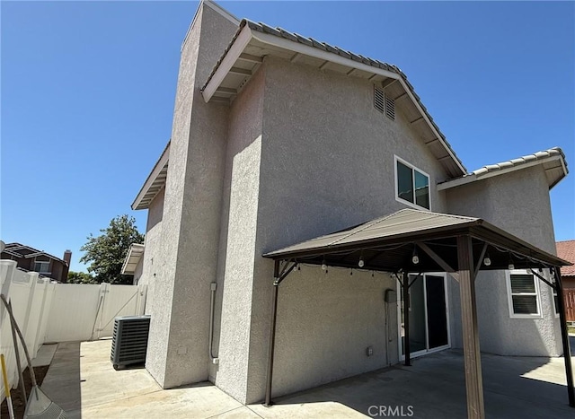 26490 Mapleridge Way, Moreno Valley, CA 92555 - rear view of property featuring a patio, cooling unit, stucco siding, and a gazebo