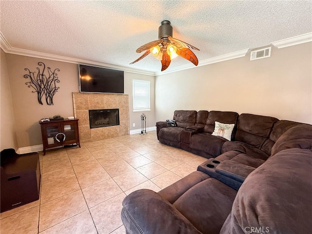 26490 Mapleridge Way, Moreno Valley, CA 92555 - living area featuring crown molding, ceiling fan, light tile patterned flooring, a tiled fireplace, and baseboards