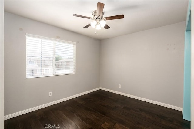 27917 Busman Rd, Murrieta, CA 92563 - spare room with dark wood-type flooring, baseboards, and a ceiling fan