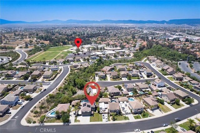 27917 Busman Rd, Murrieta, CA 92563 - aerial overview of property's location featuring a mountainous background and nearby suburban area