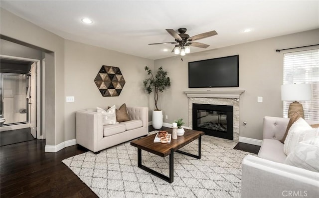 27917 Busman Rd, Murrieta, CA 92563 - living room with a ceiling fan, wood finished floors, recessed lighting, baseboards, and a fireplace
