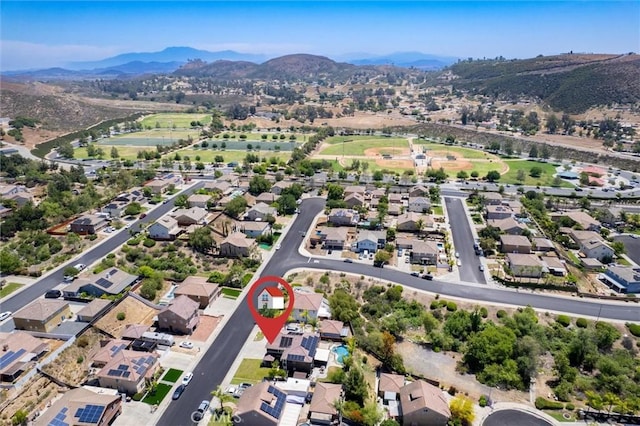 27917 Busman Rd, Murrieta, CA 92563 - aerial overview of property's location featuring a mountainous background and nearby suburban area