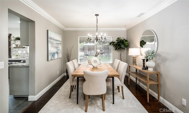 27917 Busman Rd, Murrieta, CA 92563 - dining space featuring a chandelier, dark wood-style flooring, baseboards, and crown molding