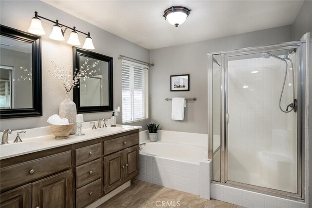 27917 Busman Rd, Murrieta, CA 92563 - full bath featuring a stall shower, a garden tub, and double vanity