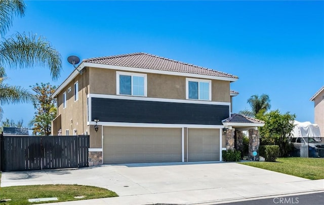 27917 Busman Rd, Murrieta, CA 92563 - traditional-style house featuring stucco siding, a garage, a tiled roof, stone siding, and driveway
