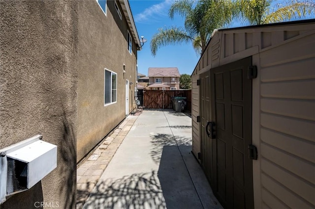 27917 Busman Rd, Murrieta, CA 92563 - view of side of property featuring stucco siding and a patio
