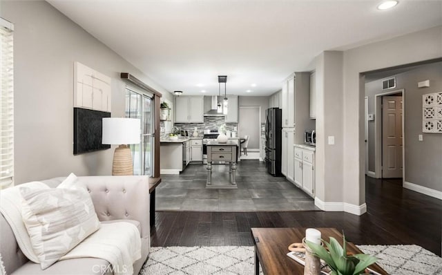 27917 Busman Rd, Murrieta, CA 92563 - living area featuring dark wood-style floors and recessed lighting