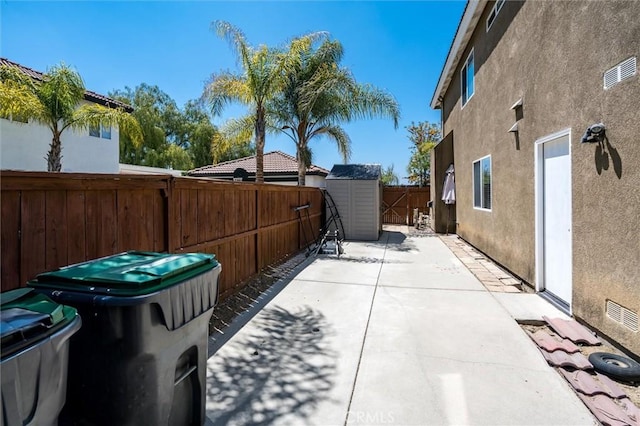 27917 Busman Rd, Murrieta, CA 92563 - fenced backyard featuring a patio and a storage shed