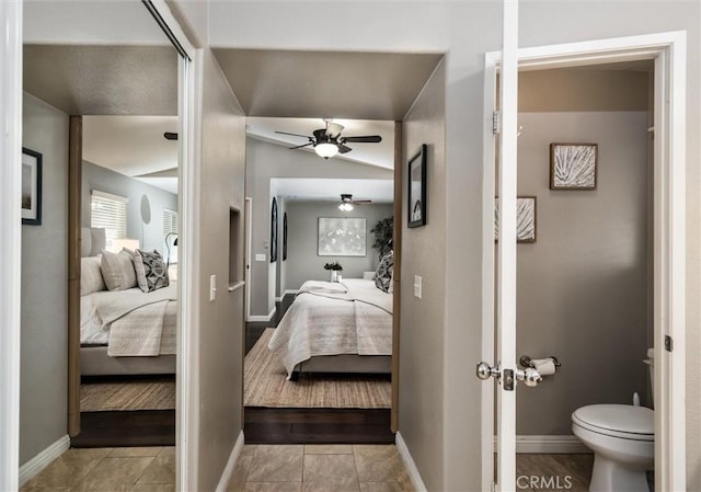 27917 Busman Rd, Murrieta, CA 92563 - ensuite bathroom featuring ceiling fan, baseboards, toilet, and tile patterned flooring