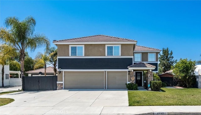 27917 Busman Rd, Murrieta, CA 92563 - view of front of property featuring a garage, a tile roof, stone siding, and stucco siding