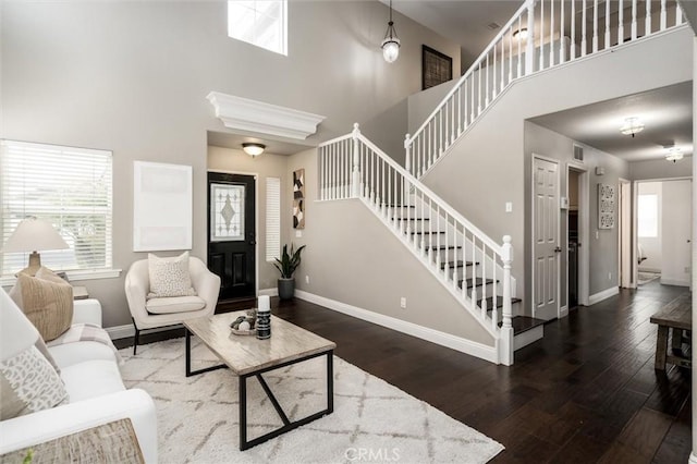 27917 Busman Rd, Murrieta, CA 92563 - living area featuring a high ceiling, stairway, and wood-type flooring