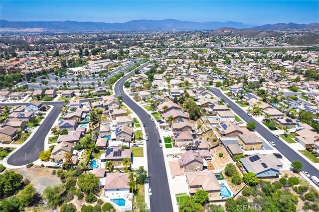 27917 Busman Rd, Murrieta, CA 92563 - aerial overview of property's location featuring a mountainous background and nearby suburban area