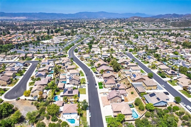 27917 Busman Rd, Murrieta, CA 92563 - aerial overview of property's location featuring a mountainous background and nearby suburban area