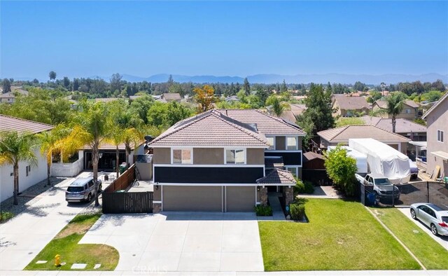 27917 Busman Rd, Murrieta, CA 92563 - view of front of property featuring a garage, concrete driveway, a front lawn, a residential view, and stucco siding