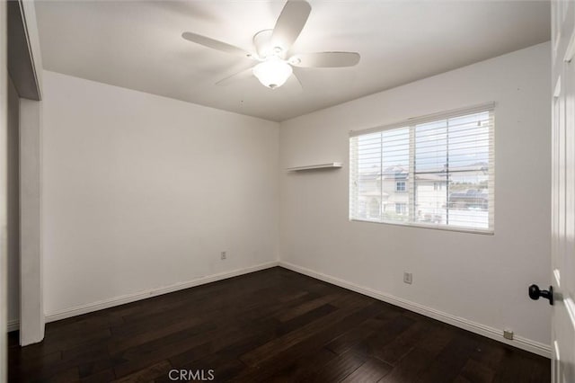 27917 Busman Rd, Murrieta, CA 92563 - empty room with dark wood-style floors, baseboards, and ceiling fan