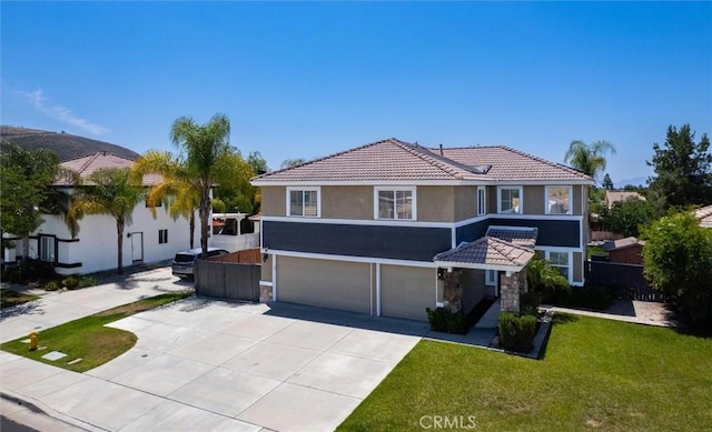 27917 Busman Rd, Murrieta, CA 92563 - mediterranean / spanish house featuring an attached garage, stone siding, stucco siding, and a tiled roof