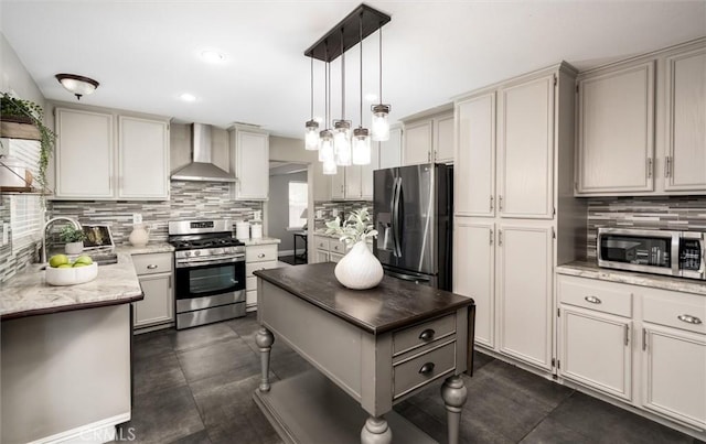 27917 Busman Rd, Murrieta, CA 92563 - kitchen with stainless steel appliances, wall chimney range hood, tasteful backsplash, hanging light fixtures, and recessed lighting