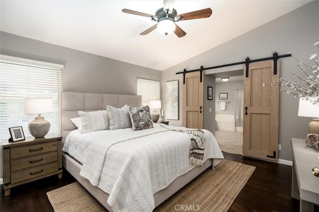 27917 Busman Rd, Murrieta, CA 92563 - bedroom with a barn door, multiple windows, dark wood finished floors, and lofted ceiling