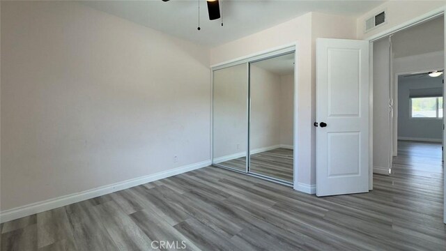 27533 Caraway Ln, Saugus, CA 91350 - unfurnished bedroom featuring wood finished floors, a closet, and a ceiling fan