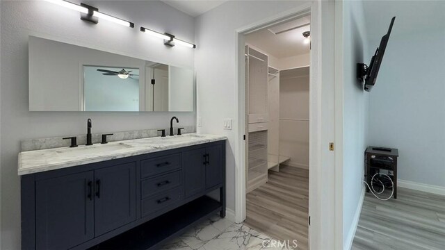 27533 Caraway Ln, Saugus, CA 91350 - bathroom with double vanity, a spacious closet, and a ceiling fan