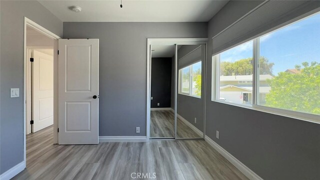 27533 Caraway Ln, Saugus, CA 91350 - unfurnished bedroom featuring wood finished floors and baseboards