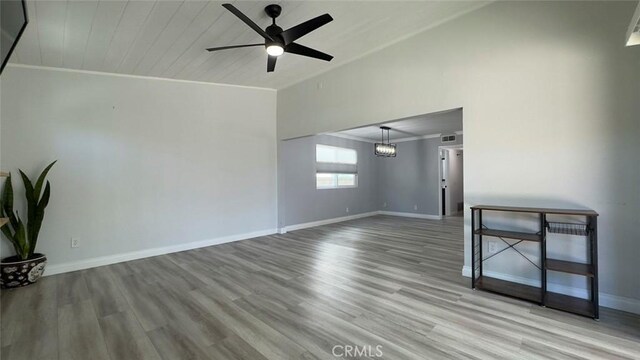 27533 Caraway Ln, Saugus, CA 91350 - empty room with ceiling fan, wood finished floors, ornamental molding, and high vaulted ceiling