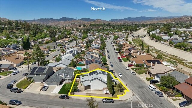 27533 Caraway Ln, Saugus, CA 91350 - aerial view of residential area with a mountainous background and property parcel outlined