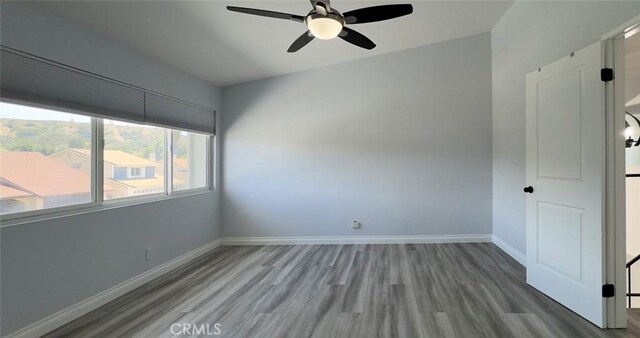 27533 Caraway Ln, Saugus, CA 91350 - spare room featuring ceiling fan and wood finished floors