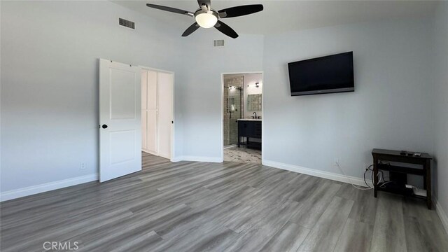 27533 Caraway Ln, Saugus, CA 91350 - unfurnished living room with a ceiling fan, wood finished floors, and a towering ceiling