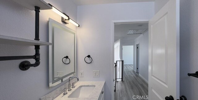 27533 Caraway Ln, Saugus, CA 91350 - bathroom featuring vanity and wood finished floors