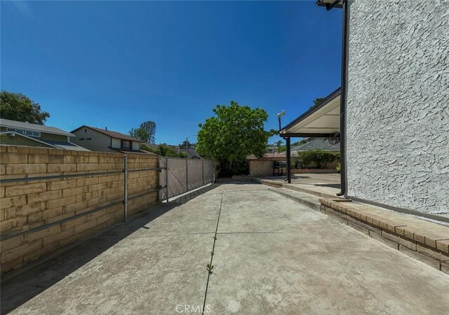 27533 Caraway Ln, Saugus, CA 91350 - fenced backyard featuring a patio area