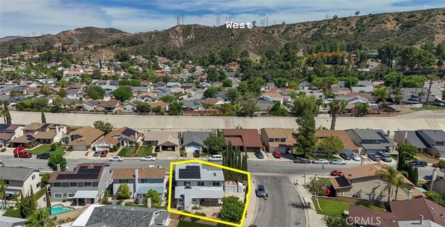 27533 Caraway Ln, Saugus, CA 91350 - aerial view of residential area featuring a mountain backdrop and property boundaries highlighted