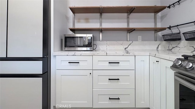 27533 Caraway Ln, Saugus, CA 91350 - kitchen featuring open shelves, appliances with stainless steel finishes, and white cabinets