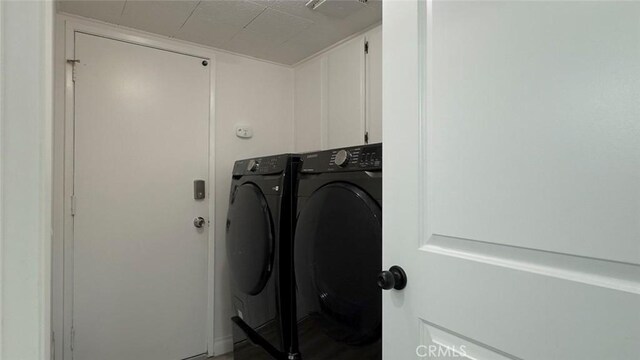 27533 Caraway Ln, Saugus, CA 91350 - laundry area featuring washer and dryer and cabinet space