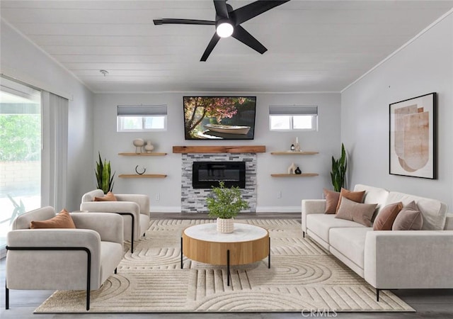 27533 Caraway Ln, Saugus, CA 91350 - living area featuring a glass covered fireplace, wood finished floors, healthy amount of natural light, and ornamental molding