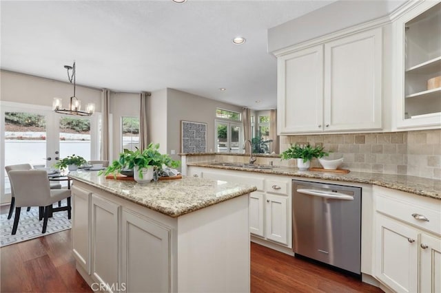 26752 Devonshire Rd, Laguna Hills, CA 92653 - kitchen with stainless steel dishwasher, a sink, dark wood-style floors, a kitchen island, and a chandelier