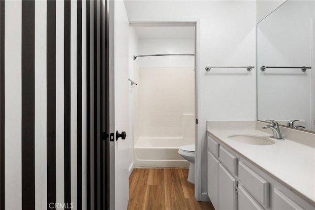 15015 Sherman Way Unit 314, Van Nuys, CA 91405 - bathroom with wood finished floors, toilet, vanity, and shower / bathtub combination
