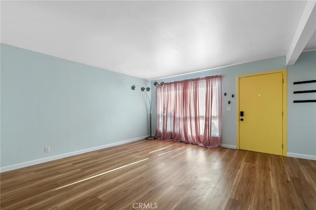 15015 Sherman Way Unit 314, Van Nuys, CA 91405 - unfurnished living room featuring wood finished floors and baseboards