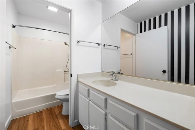 15015 Sherman Way Unit 314, Van Nuys, CA 91405 - full bath with toilet, wood finished floors, vanity, and shower / bathtub combination