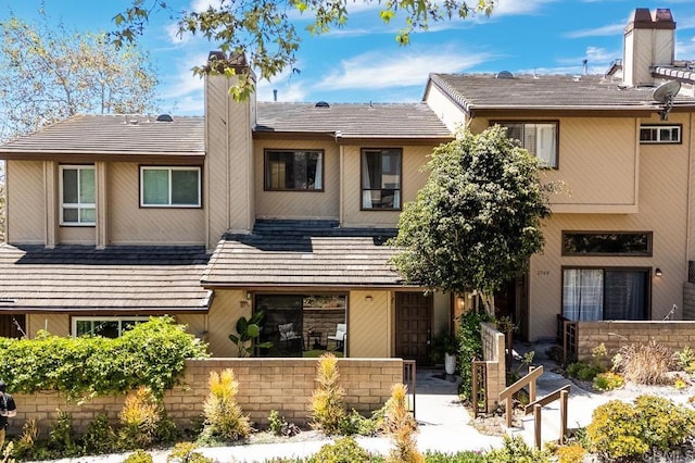 2506 Woodlands Way, Oceanside, CA 92054 - view of property featuring a chimney and fence