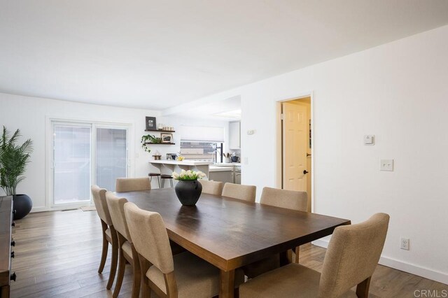 2506 Woodlands Way, Oceanside, CA 92054 - dining room with wood finished floors and baseboards