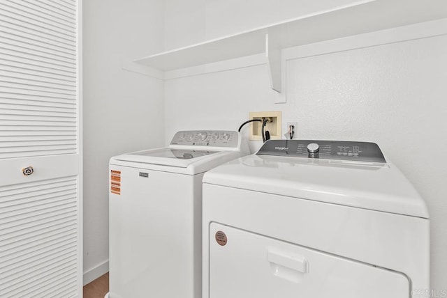 washroom with separate washer and dryer