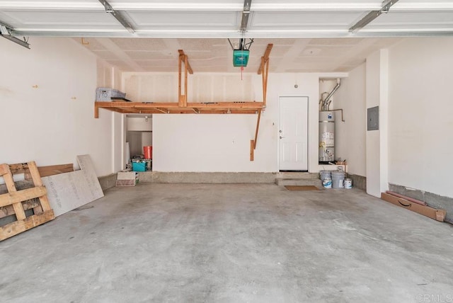 garage featuring secured water heater and a garage door opener