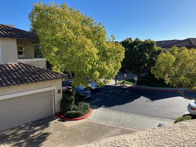 6180 Citracado Cir, Carlsbad, CA 92009 - exterior view of a tile roof and stucco siding