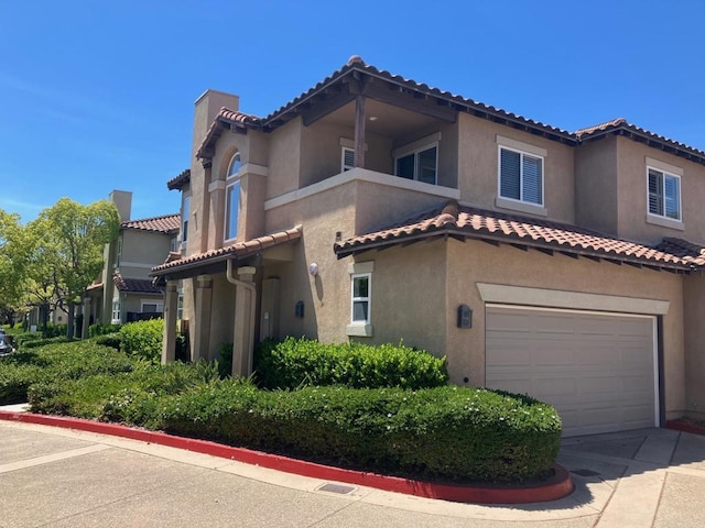 6180 Citracado Cir, Carlsbad, CA 92009 - mediterranean / spanish-style house featuring a garage, a tiled roof, a chimney, and stucco siding