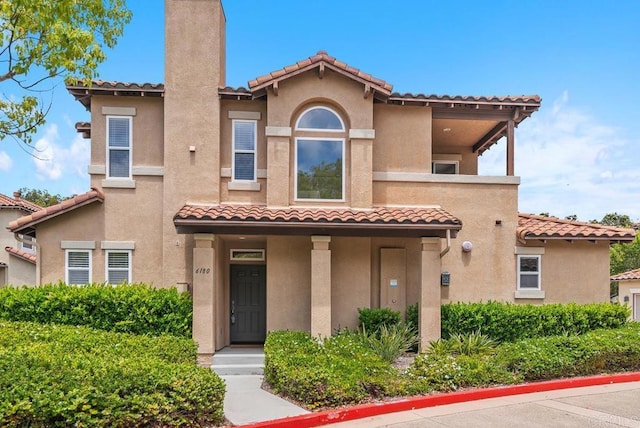 6180 Citracado Cir, Carlsbad, CA 92009 - mediterranean / spanish home with a tile roof and stucco siding